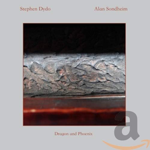 CD cover with a textured tree bark image and text: “Dragon and Phoenix.”