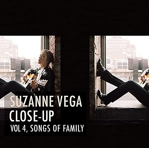 Suzanne Vega album cover: artist leaning against a window, playing guitar.