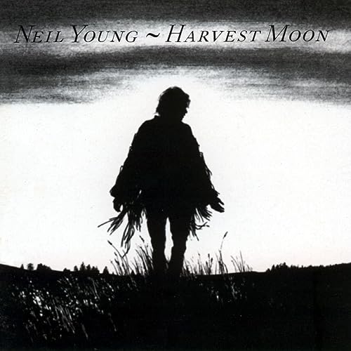 Neil Young's "Harvest Moon" album cover: silhouetted figure in a field.