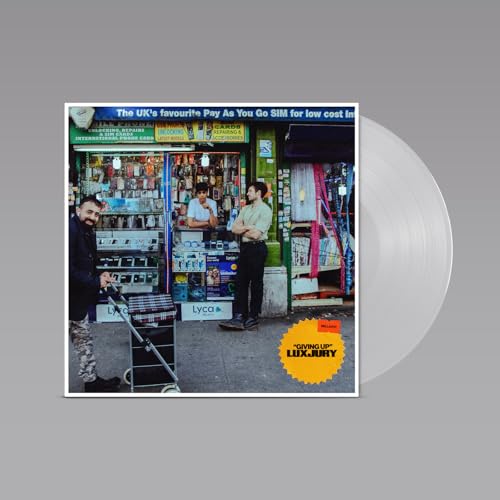 Vinyl record cover with a street scene and orange "Giving Up" label.