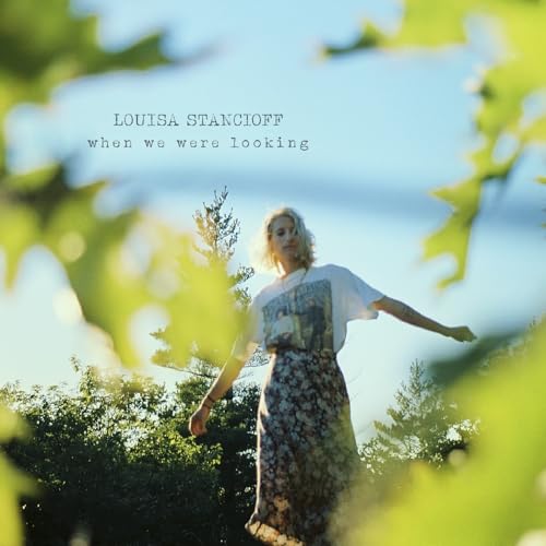 Album cover for Louisa Stancioff’s “When We Were Looking” with a woman outdoors.