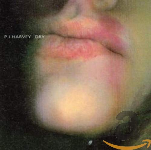 PJ Harvey's "Dry" CD cover: close-up of blurred lips against a dark background.