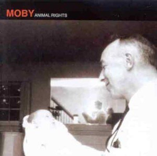 Black and white album cover featuring a man and a small white dog.