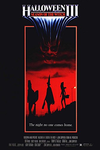 Halloween III movie poster with a menacing face and silhouetted children.