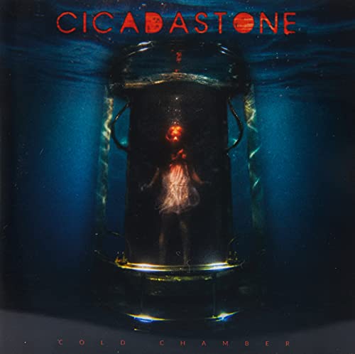Album cover: figure in a submerged, glowing cylindrical chamber.