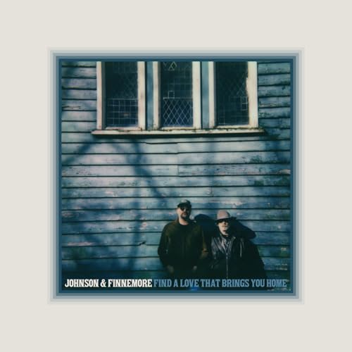 Vinyl album cover featuring two figures silhouetted against a blue wooden wall.