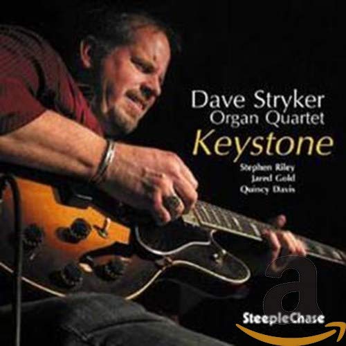Jazz guitarist Dave Stryker playing an orange guitar on album cover.