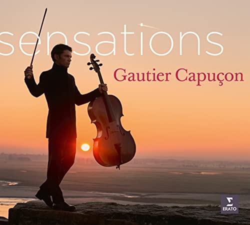 Cellist Gautier Capuçon stands with his instrument against a sunset backdrop.