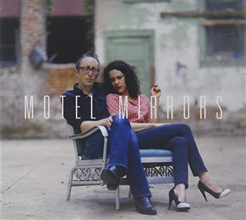 CD cover featuring a man and woman sitting outdoors, with text.