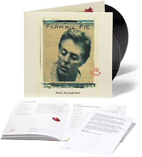 Paul McCartney’s “Flaming Pie” vinyl record with album cover and inserts.