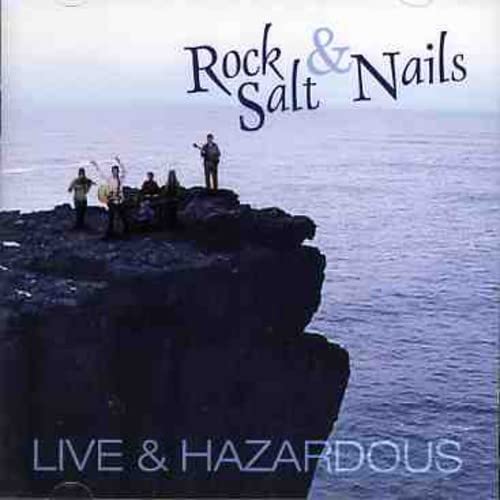 CD cover: band on cliff edge overlooking blue ocean.