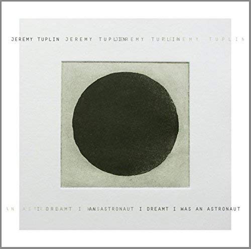 CD cover: white background with a black circle and text.
