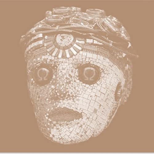 Mosaic mask with large eyes and intricate metallic details, brown background.