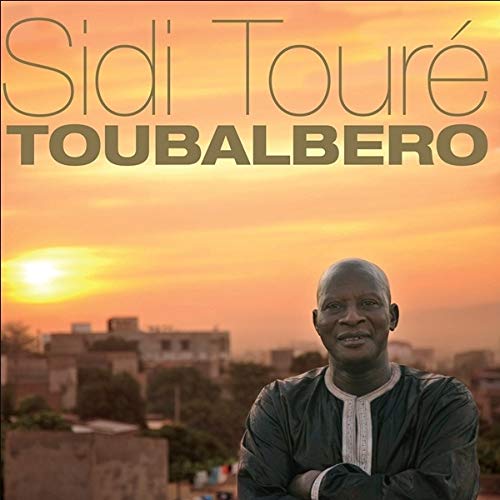 CD cover for Sidi Touré’s “Toubalbero” featuring a portrait and sunset.