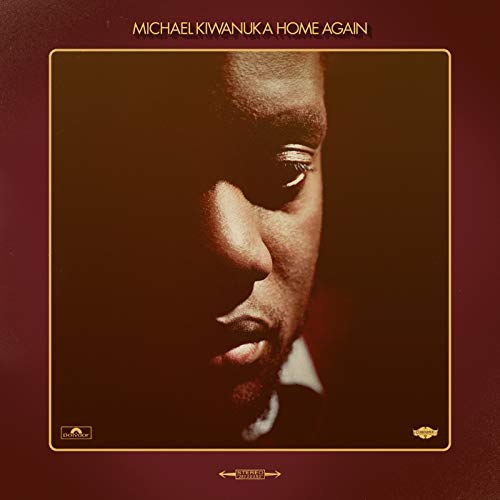 Album cover featuring a close-up, shadowed portrait of Michael Kiwanuka on a maroon background.