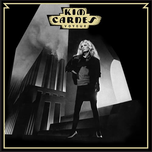 Kim Carnes standing in front of industrial smokestacks on the Voyeur album cover.