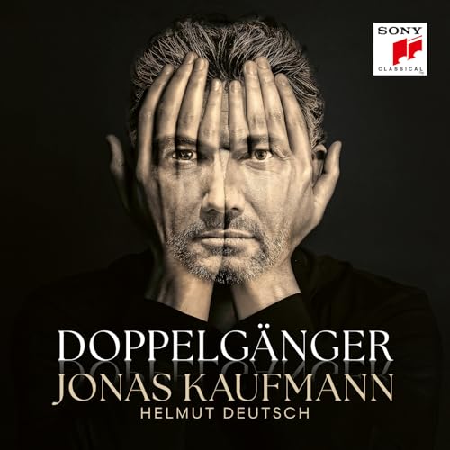 Jonas Kaufmann’s portrait with hands obscuring his face, album cover.