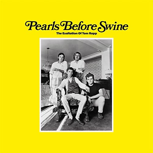Yellow album cover with a black and white photo of four men.