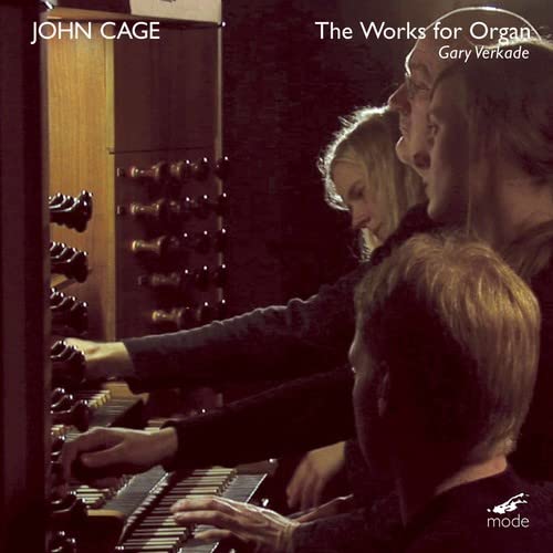 CD cover featuring an organist playing, with people observing.
