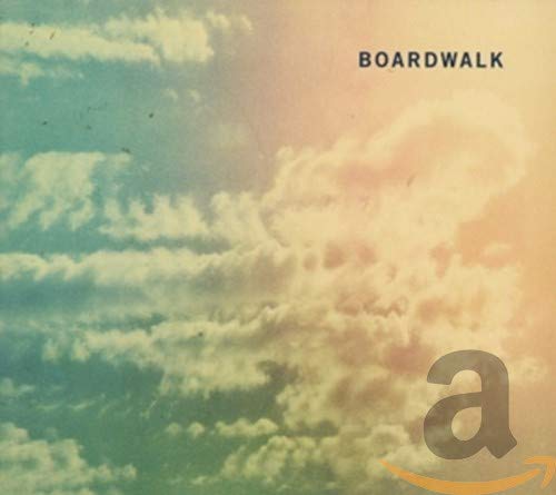 CD cover for “Boardwalk” with a cloudy, colorful sky background.