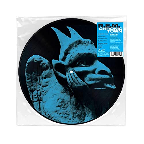 Picture disc vinyl record featuring a blue-tinted sculpture of a winged figure.