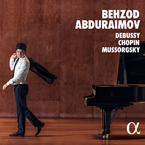 Pianist Behzod Abduraimov with a grand piano, album cover art.