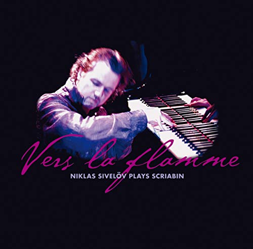 CD cover featuring a man playing a piano against a black background.