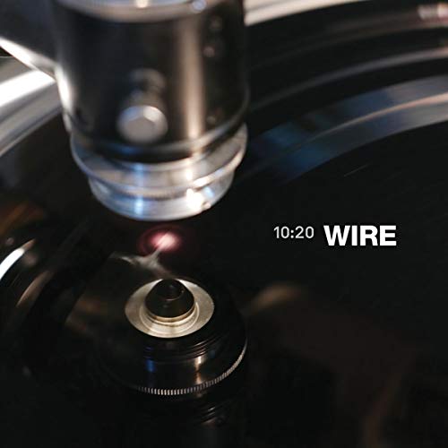 Record player needle on a black vinyl record labeled "10:20 WIRE".