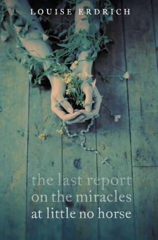 Book cover: hands holding flowers and rosary on wooden floor.