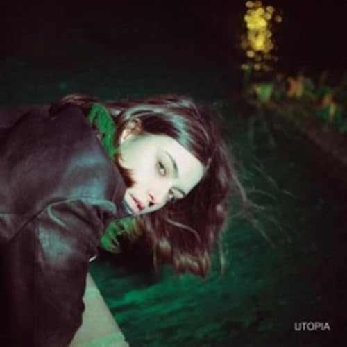 KYNSY album cover: woman with long hair lying in greenery.