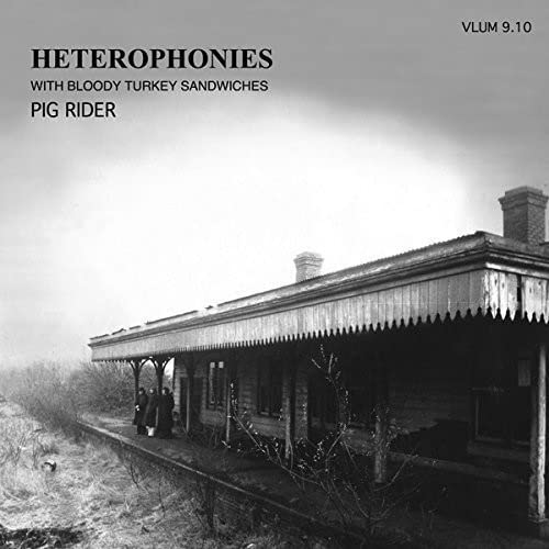 Black and white CD cover with a rural train station scene.