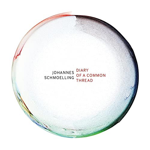 CD cover: white circle with red and green accents, text in center.
