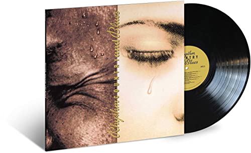 Vinyl record with album cover featuring a close-up of a crying eye.