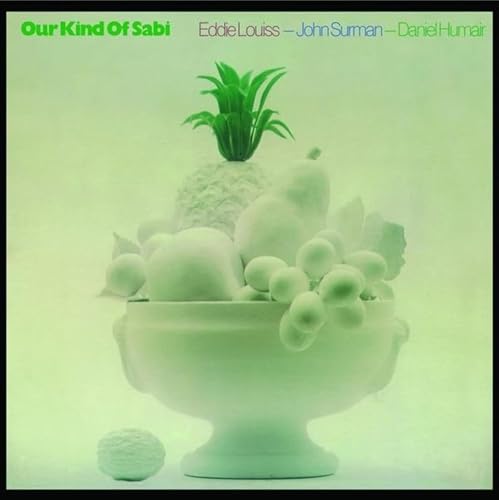 Green-toned album cover featuring a bowl overflowing with rounded objects and plants.