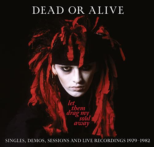 CD cover: Pete Burns of Dead or Alive with red fringe, dark background.