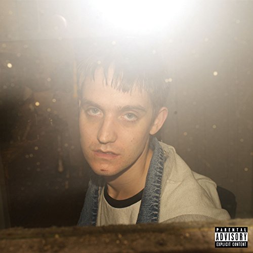 CD cover: portrait of a young man with a hazy, grainy background.