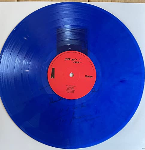 Blue vinyl record with red label, text, and a central spindle hole.