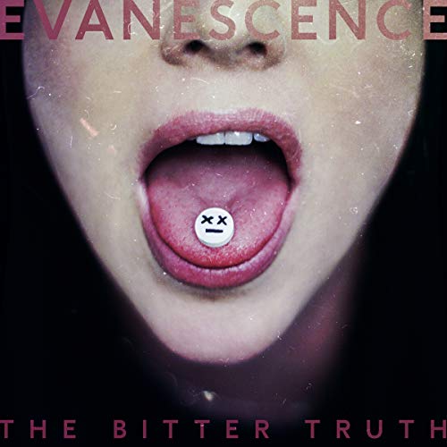 Close-up of a mouth with a smiley face piercing on the tongue.