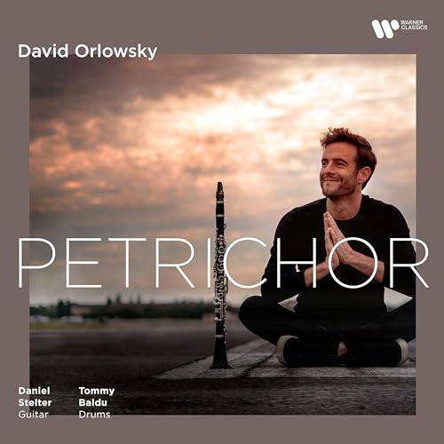 CD cover: Man with clarinet against a cloudy, atmospheric sky.