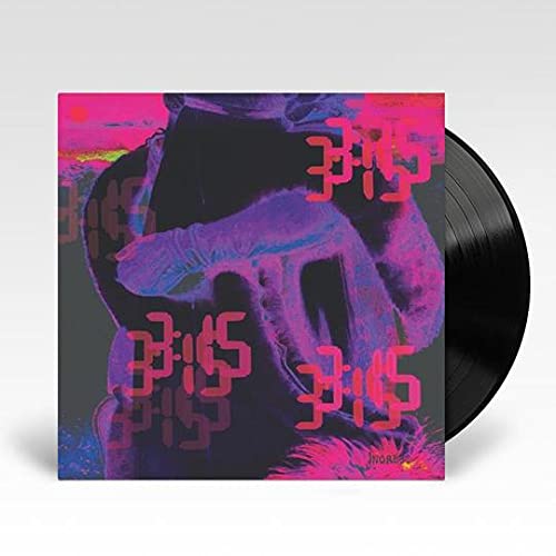 Vinyl record with album art featuring a figure and pink text.