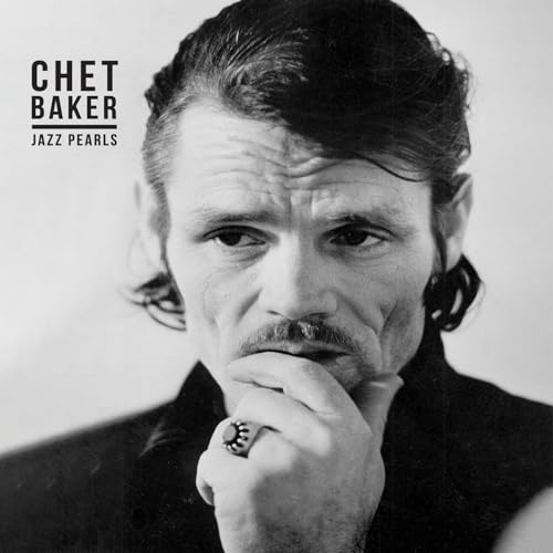 Black and white portrait of jazz musician Chet Baker, looking intently.