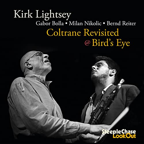 Black and white photo of two jazz musicians with "Coltrane Revisited" text.
