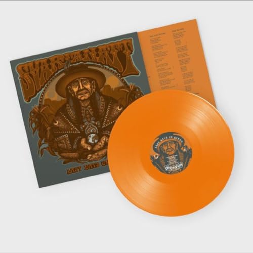 Orange vinyl record with album cover featuring a portrait of a man.