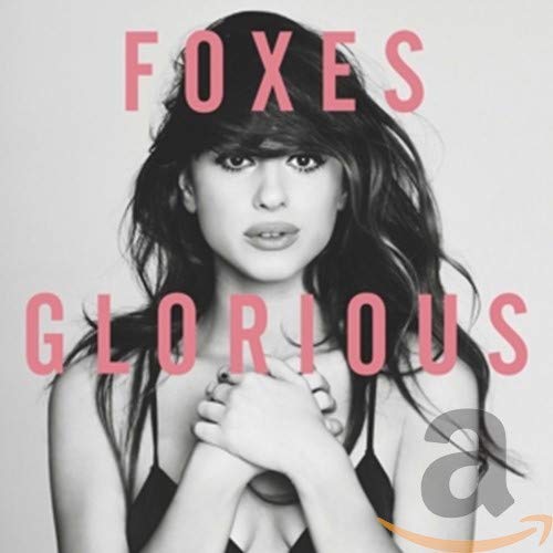 Black and white portrait of Foxes with pink text “FOXES Glorious”.
