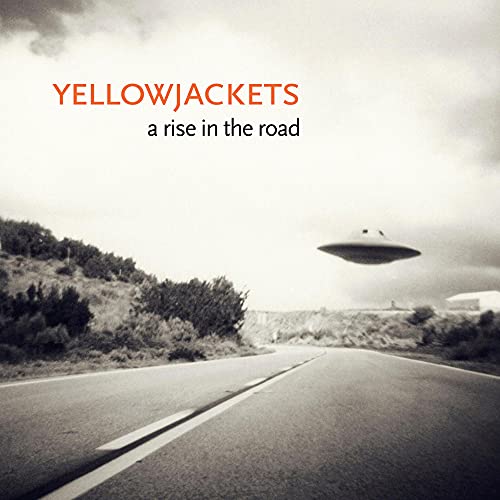 Yellowjackets album cover: road, UFO, and text on a grayscale background.