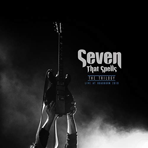 Black and white album cover featuring a raised guitar and text “Seven That Spells”.