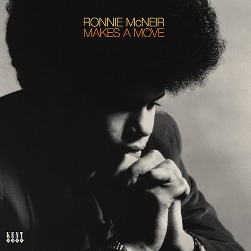 Black and white portrait of Ronnie Mcneir with clasped hands, album cover.