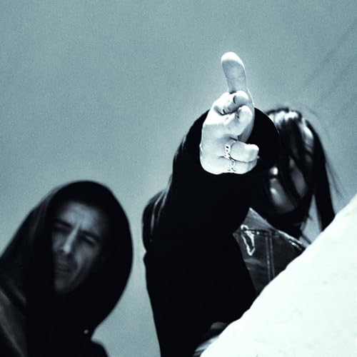 Hooded figures, one with a raised middle finger, in grayscale.