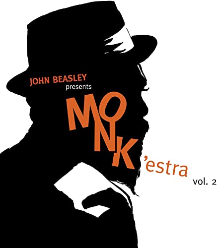 Black and orange album cover featuring a silhouette of a man in a hat.