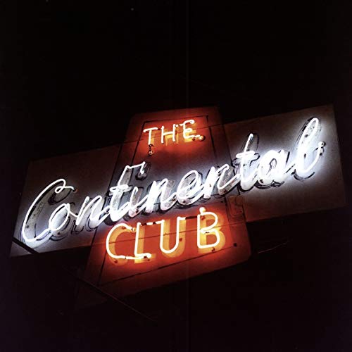 Neon sign reading "The Continental Club" against a dark background.